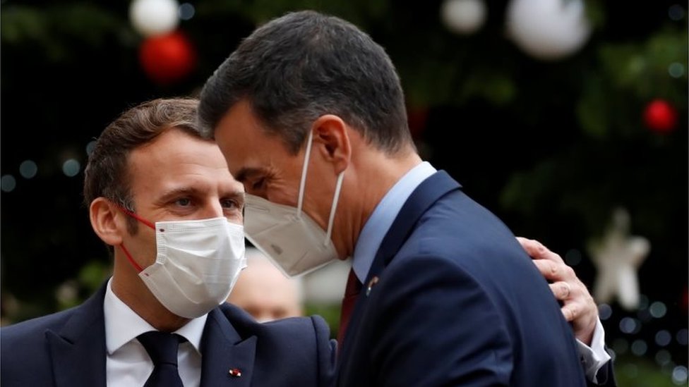 French President Emmanuel Macron welcomes Spanish Prime Minister Pedro Sanchez at the Elysee Palace as part of events marking the 60th anniversary of the signing of the OECD convention in Paris, France, on 14 December 2020.