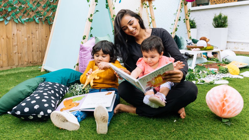 Children and a worker at a Tiney home nursery