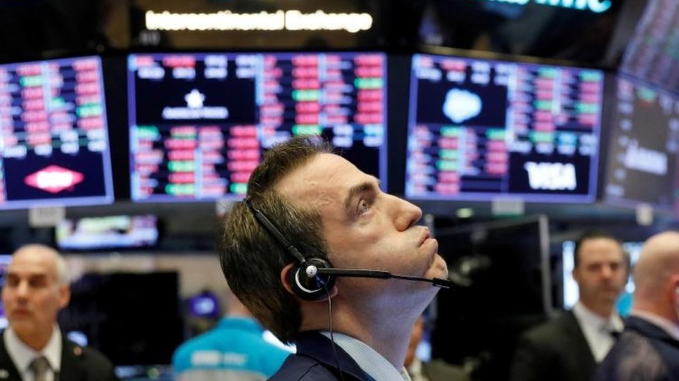 A trader works on the floor of the New York Stock Exchange