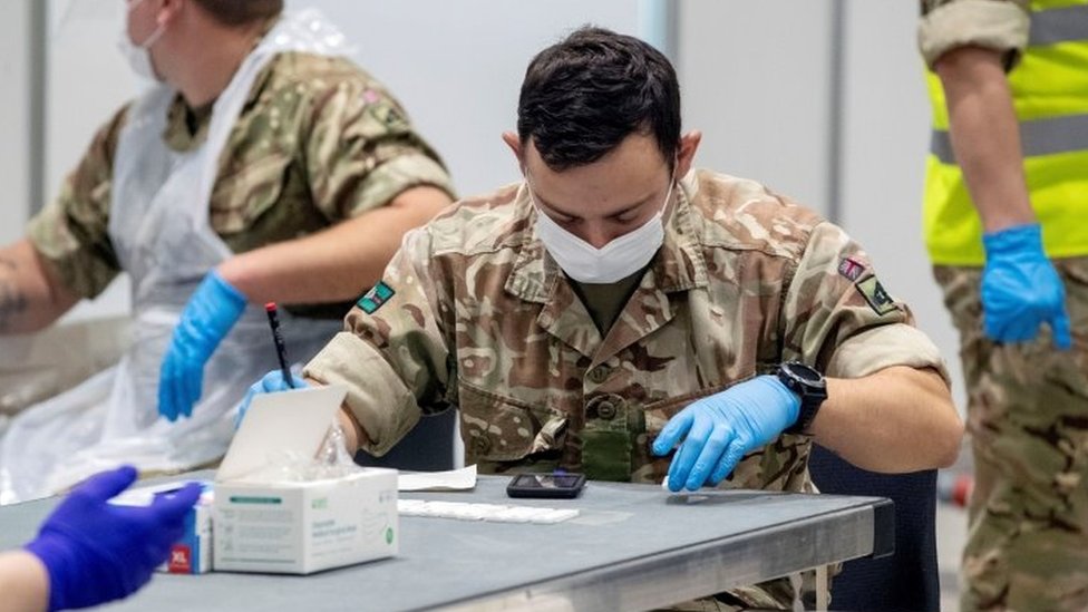 Soldiers work at The Exhibition Centre, which has been set up as a testing centre