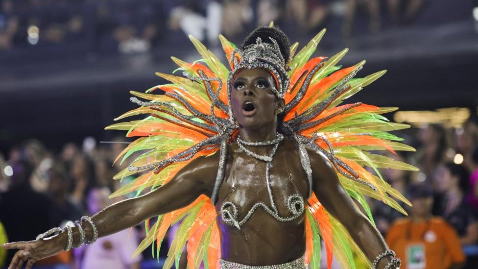 A reveller from Viradouro samba school performs during the night of the Carnival parade at the Sambadrome, in Rio de Janeiro, Brazil February 13, 2024.