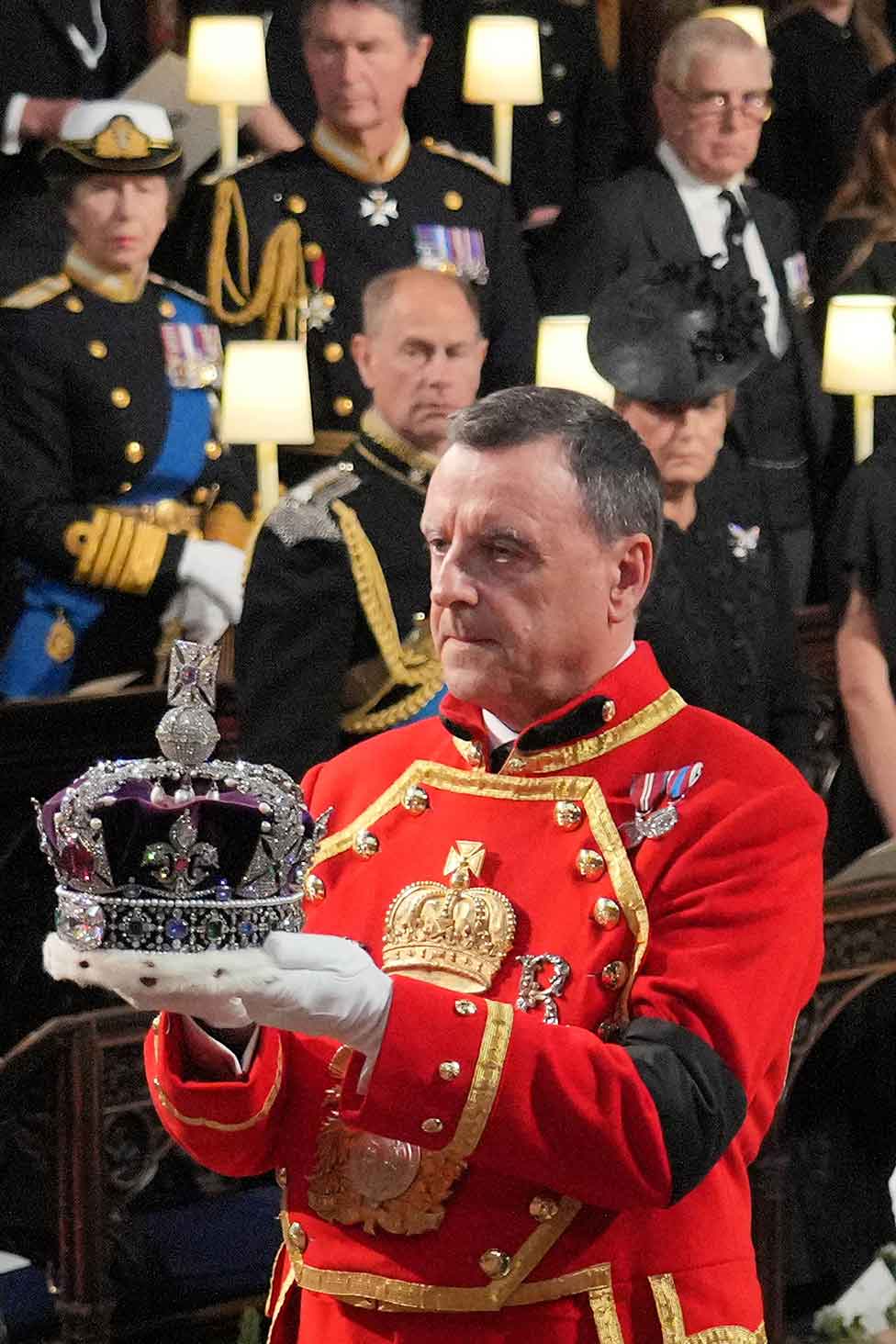 The Imperial State Crown is removed from the coffin at the Committal Service