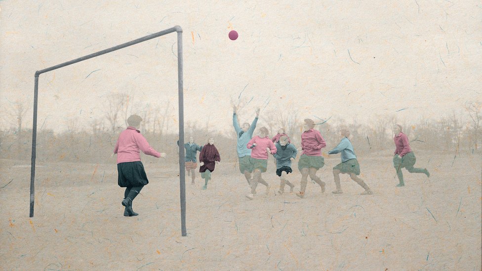 A group of girls playing football