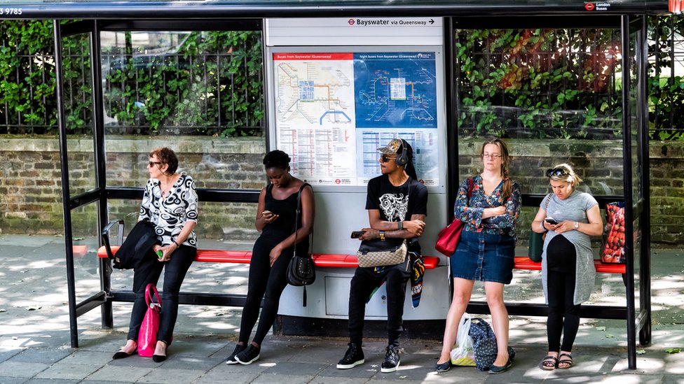 Group of people at a bus stop