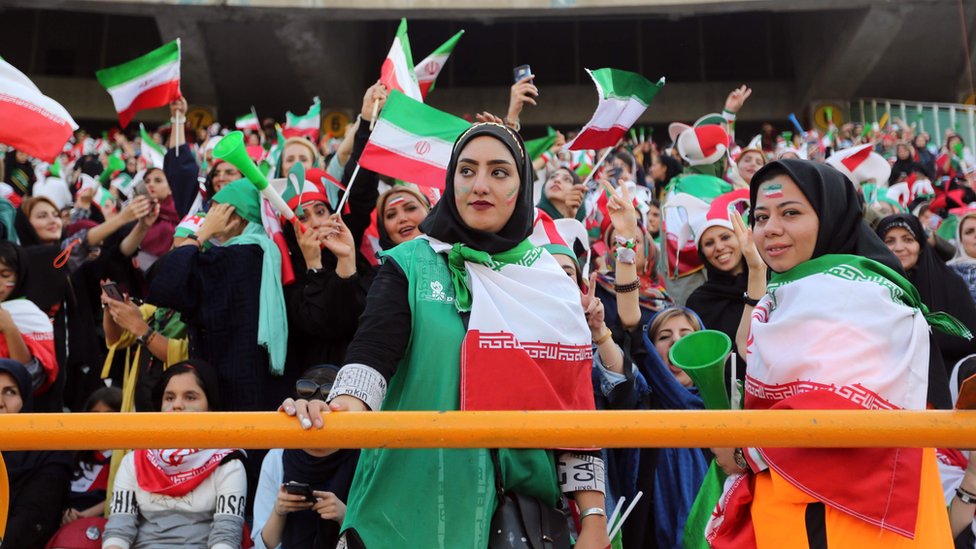 Iranian women cheer during the World Cup Qatar 2022 Group C qualification football match between Iran and Cambodia at the Azadi stadium in the capital Tehran on 10 October , 2019.