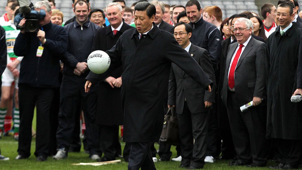 President Xi Jinping kicking a ball during a visit to Dublin in 2012