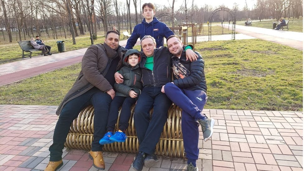 Ashraf alongside members of his family in a park in Kryvyi Rih