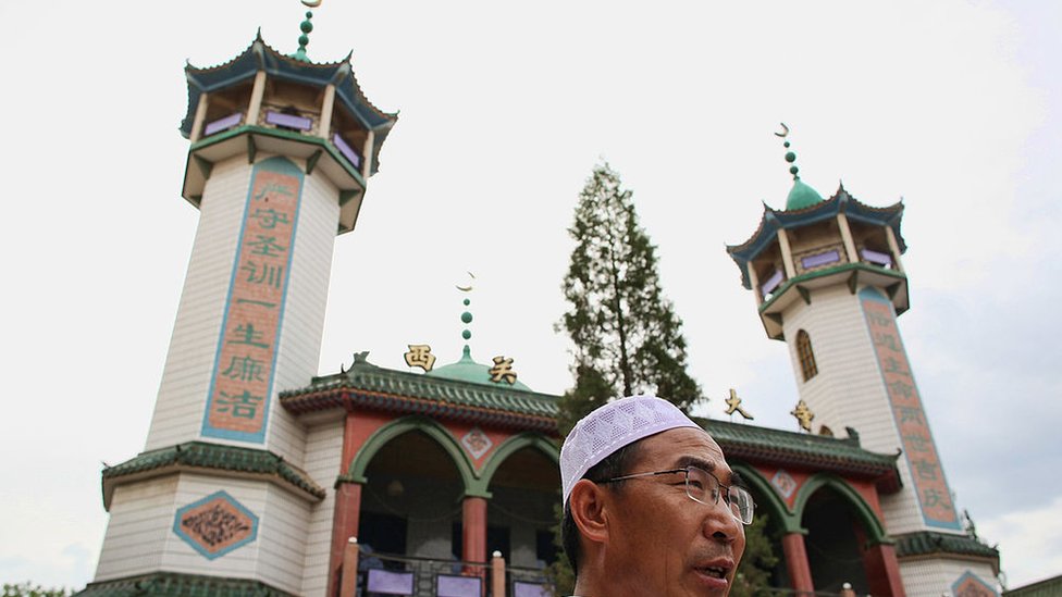 Photo of a Hui Muslim attending prayer in Yingchuan, Ningxia