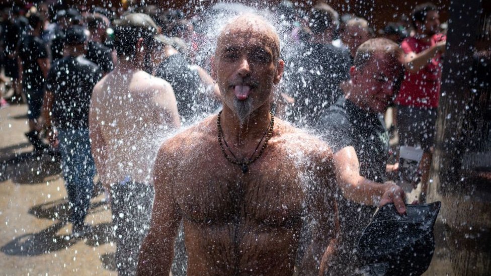 Image shows man cooling off