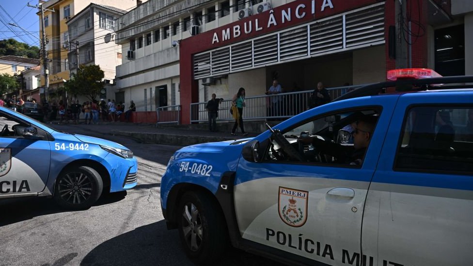 Vehicles of the Rio de Janeiro's Military Police are parked outside the Getulio Vargas hospital, where injured and dead people were admitted after a police operation at the Complexo da Penha favela complex in Rio de Janeiro, Brazil on August 2, 2023.