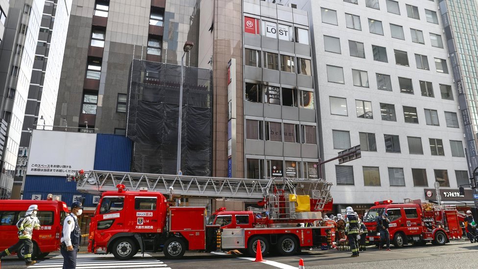 Fire trucks in front of a building where a blaze broke out in Osaka, western Japan, 17 December 2021