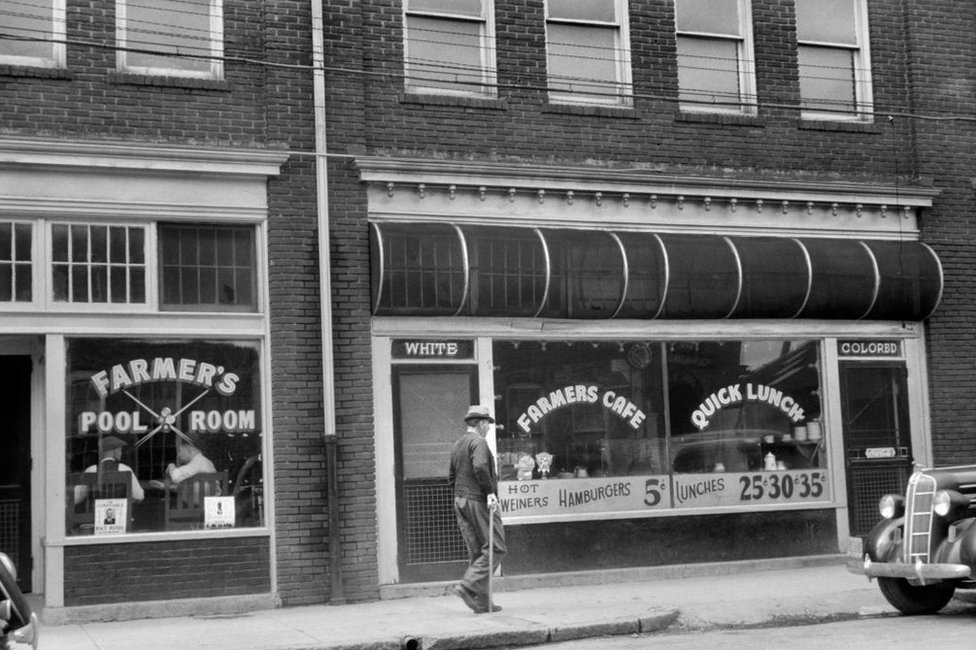 A cafeteria with two entrances, one for the "white" and another for "the colored ones" in Durham, North Carolina, in May 1940.