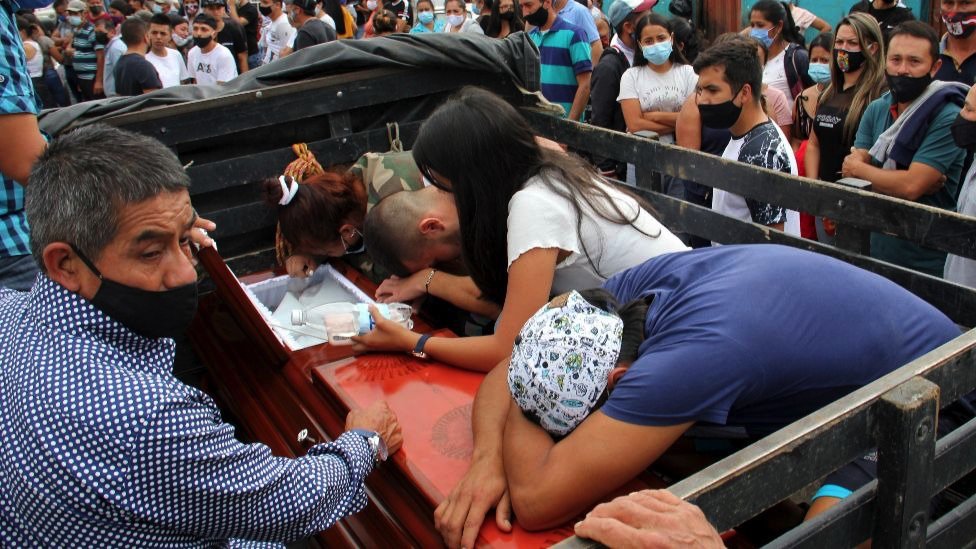 Family members bid farewell to one of the victims of the murder of nine people in Samaniego, Narino, Colombia, 16 August 2020.