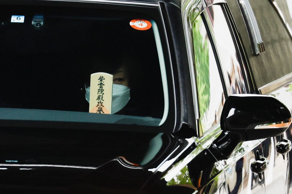 Akie Abe, wife of late former Japanese Prime Minister Shinzo Abe, who was shot while campaigning for a parliamentary election, sits in a vehicle carrying Abe's body, as she leaves after his funeral at Zojoji Temple in Tokyo, Japan July 12, 2022.