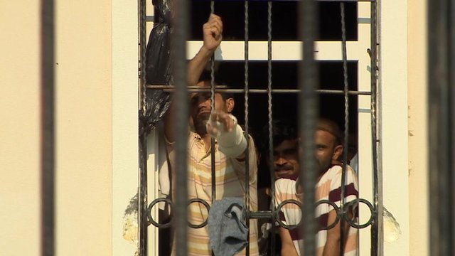 Migrants behind bars