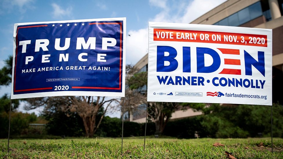 Yard signs supporting U.S. President Donald Trump and Democratic U.S. presidential nominee and former Vice President Joe Biden are seen outside of an early voting site at the Fairfax County Government Center in Fairfax, Virginia, U.S., September 18, 2020