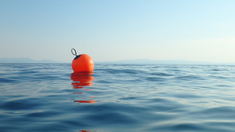 Man survives 14 hours 'clinging to sea rubbish'