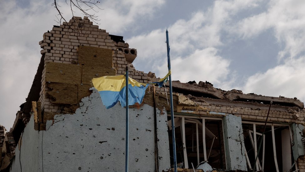 The Ukrainian flag flies outside the town administration building that was damaged during heavy shelling in the town of Derhachi outside Kharkiv, as Russia"s attack on Ukraine continues, in Ukraine, April 6