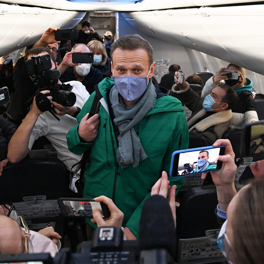 Alexei Navalny walks to take his seat on a plane heading to Moscow from Berlin Brandenburg Airport - 17 January 2021