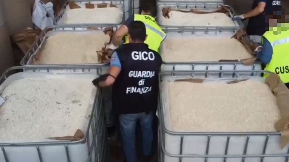 Italian police inspect tubs containing counterfeit Captagon pills