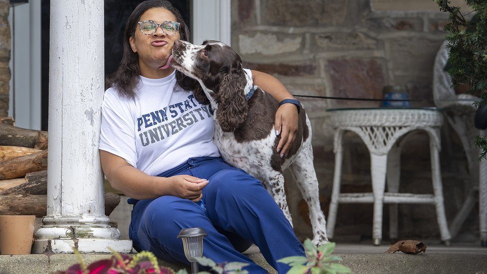 Meryl Daly-Parker, a nurse in East Norriton, Pennsylvania: sitting with her dog