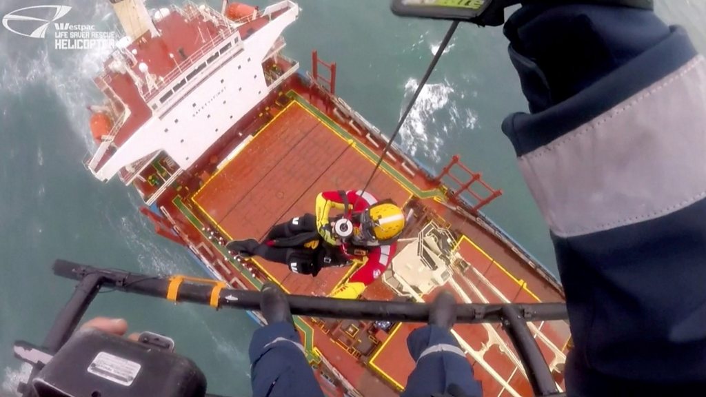 Rescuers try to save stranded cargo ship near Sydney