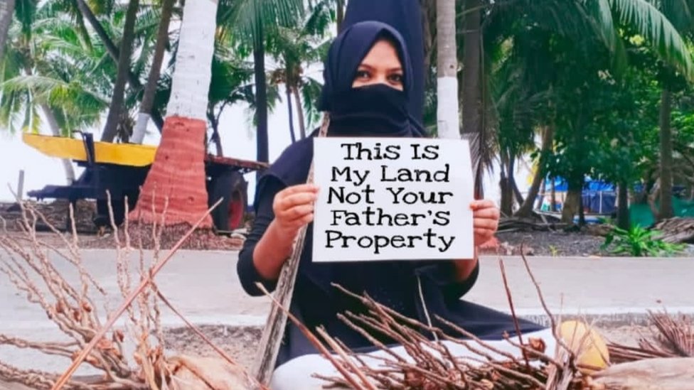 A woman protesting in Lakshadweep