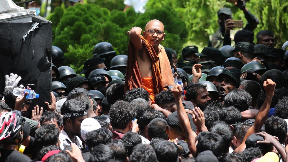 Anti-government protesters demonstrate outside the president's office in Colombo
