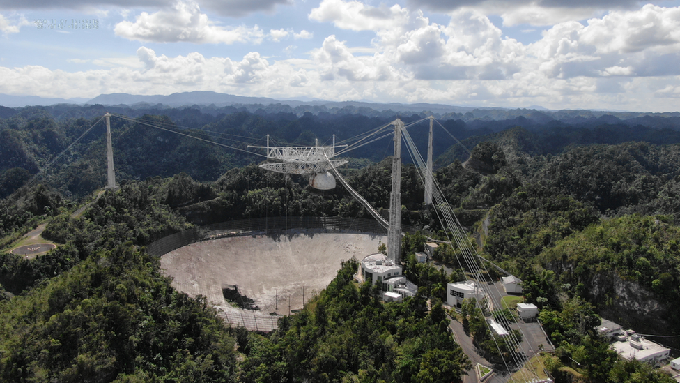 The Arecibo Observatory space telescope, which was damaged in August and in November from broken cables which tore holes in the structure, is seen in Arecibo, Puerto Rico November 7, 2020.