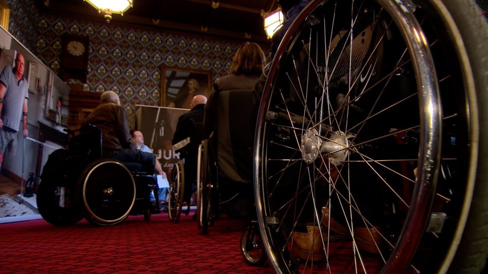 Жертвы беспорядков в инвалидных колясках
