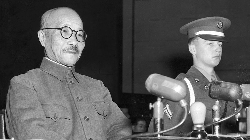Hideki Tojo, left, on trial for war crimes, 1947