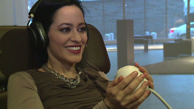 BBC Click's LJ Rich holds an orb that reacts to singing