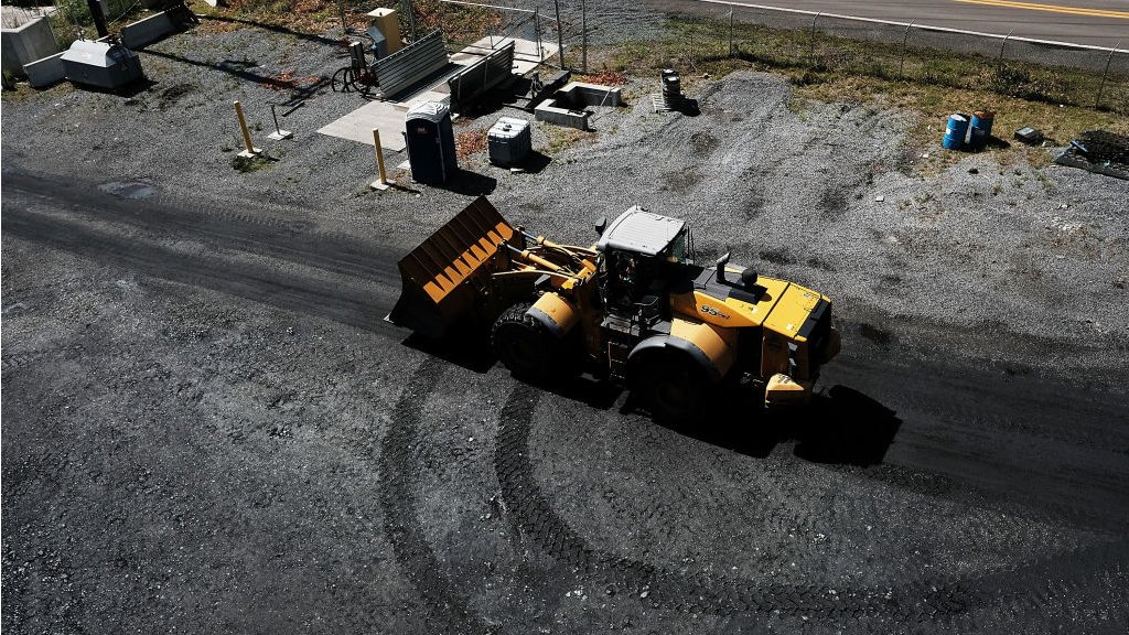 A tractor moves through a coal prep plant outside the city of Welch in rural West Virginia on May 19, 2017