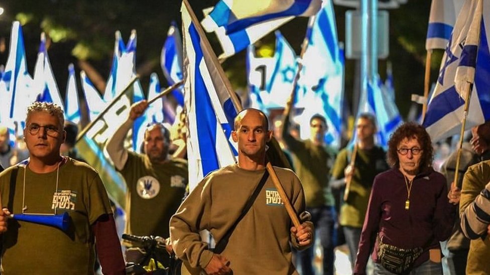 Lt Col Ron Sharf (centre) on a protest march in Israel against the government's judicial reforms