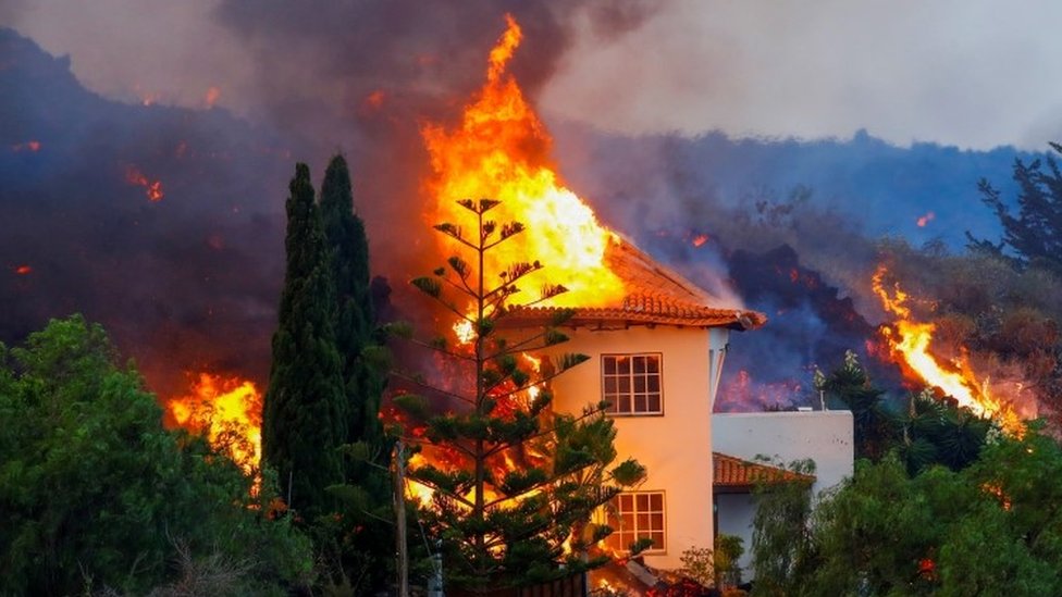 A house is burned by lava from a volcano eruption in Cumbre Vieja