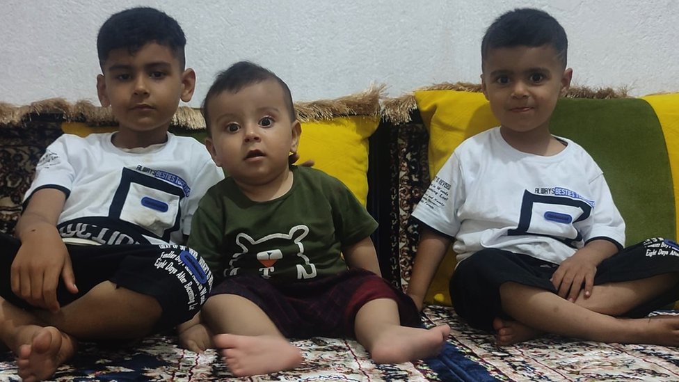 From left to right: Akif, aged six, 18-month-old Haseeb and Arif, aged four, in a family photo