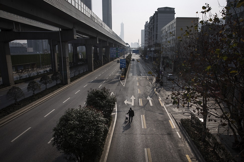 A man drags a handcart along the road on February 5, 2020 in Wuhan, Hubei province, China.