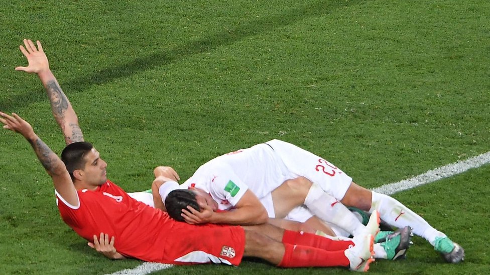 Serbia's Aleksandar Mitrovic reacts after a tackle against Switzerland