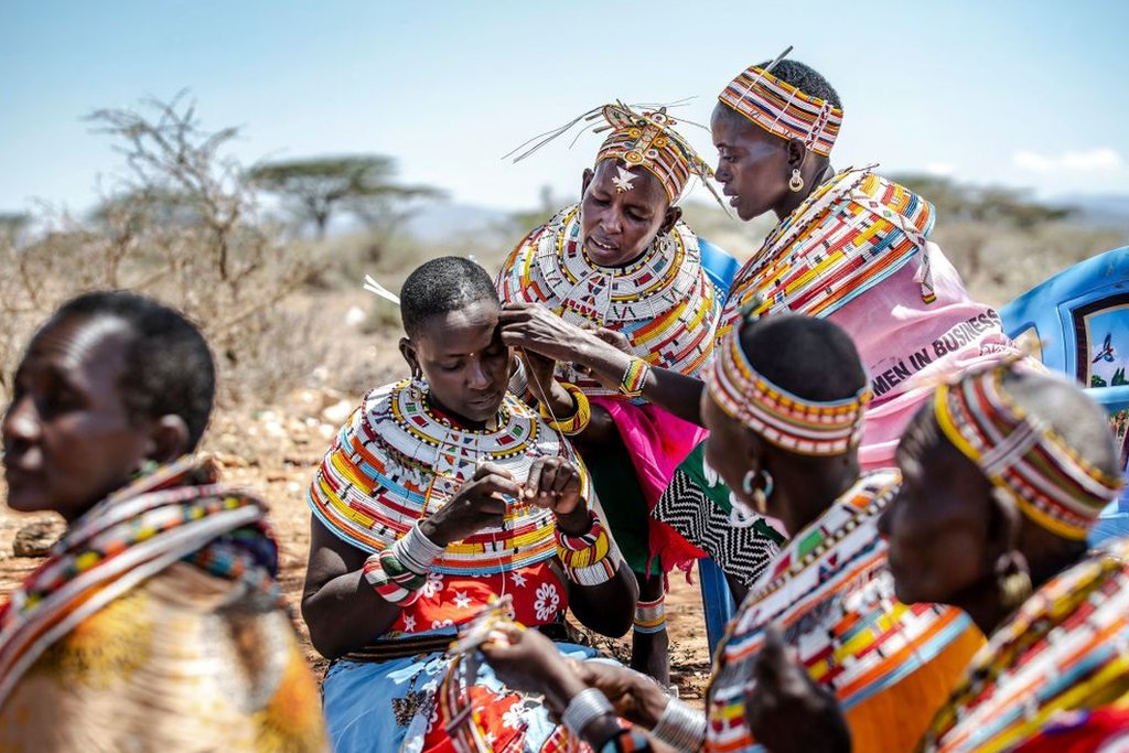 A group of Samburu women making traditional Samburu ornaments and jewellery out of beads in Sera Conservancy, Samburu County, Kenya on 10 May, 2022.