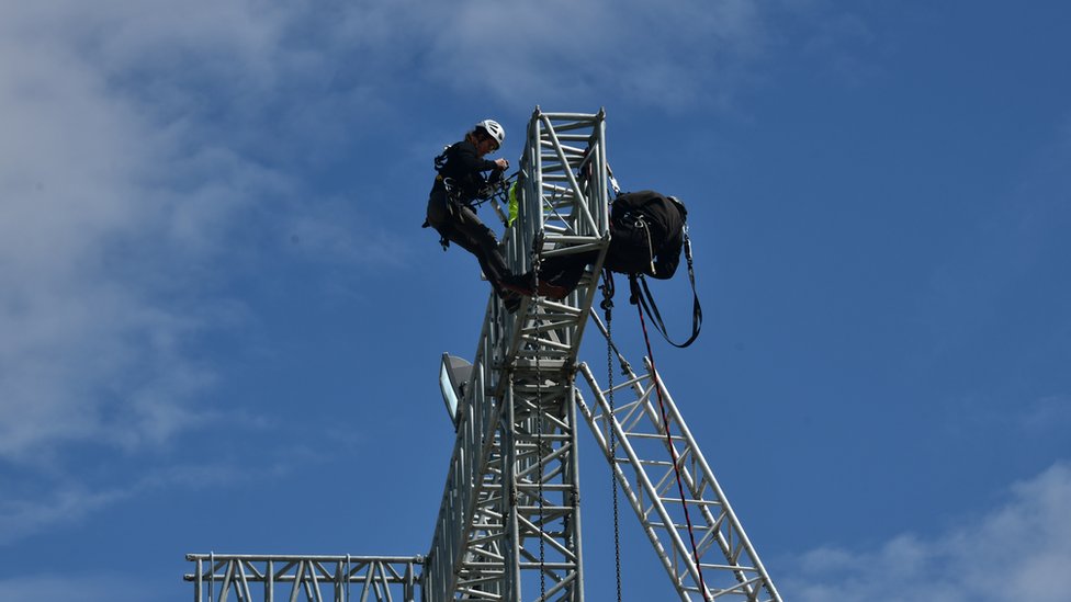 A lighting rigger at work