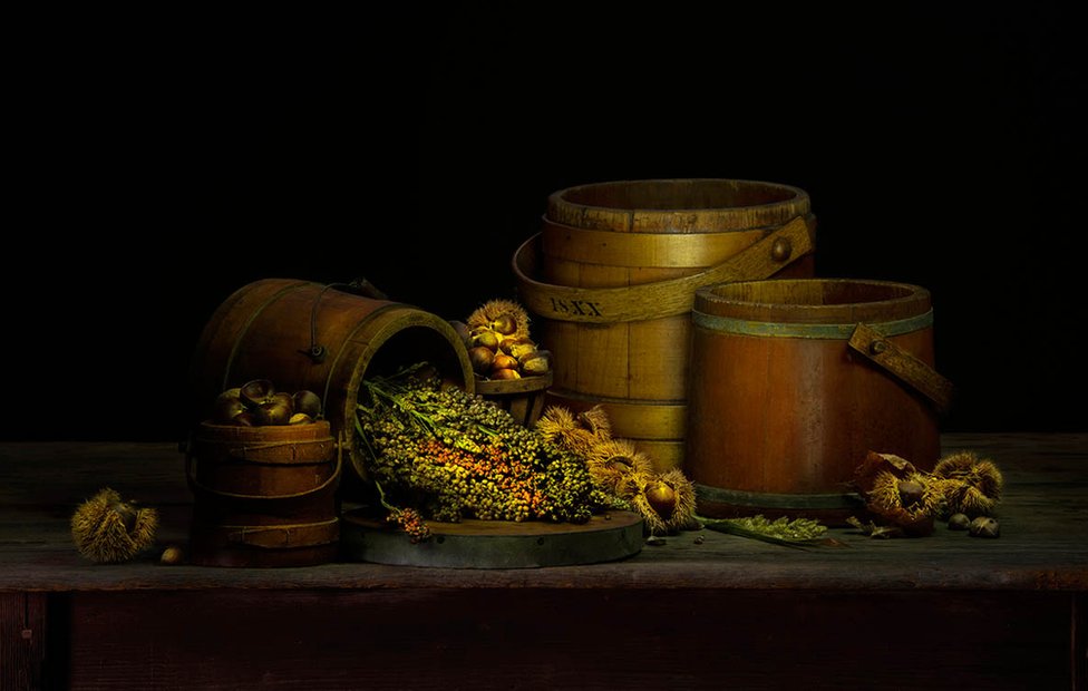 A still life of barrels and vegetables