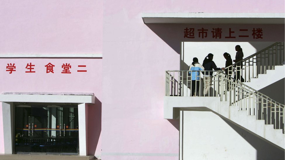 Tibetan students go upstairs to a supermarket at Nyingchi First High School, the only high school of Nyingchi Prefecture, on October 29, 2006 in Nyingchi County of Tibet Autonomous Region, China.