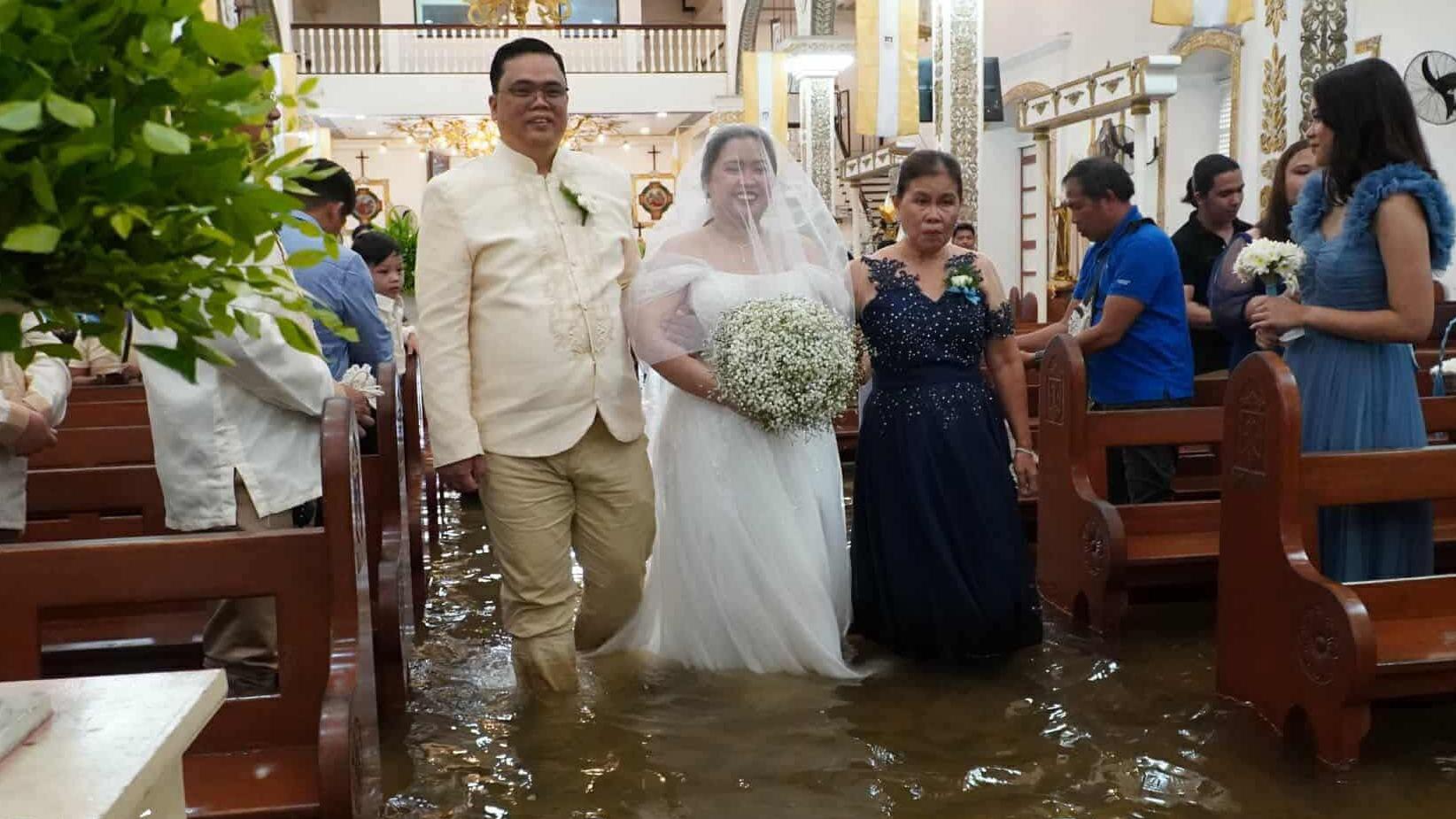 Why Filipinos keep getting married in flooded churches