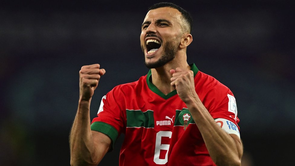 Morocco captain Romain Saiss pumps his fists after the penalty shootout as the team progress to the quarter finals