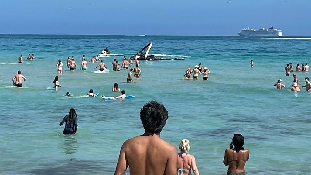 Miami helicopter crash: Police share footage showing swimmers metres away from site