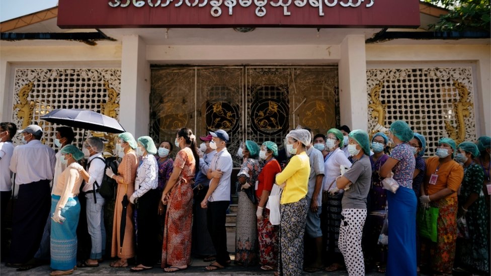 Voters queue up to cast their ballots in Yangon, Myanmar