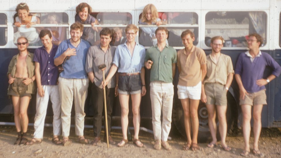 Hanging out of the windows (l-r): Sarah Lowe, Wendy Scott, Rosemary Stanning. Just visible in the bus: Carol Cave and Margaret Hardisty (Hills). Outside: Roland Lisker, Klemens Hedenig, Dick Moore, Bryan Powell, Ian Jack, Dave Stickland, Mike Hughes, Nigel Hungerford, Sandy Scott