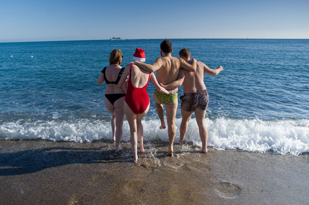 Bathers head into the Med in Barcelona on 1 January