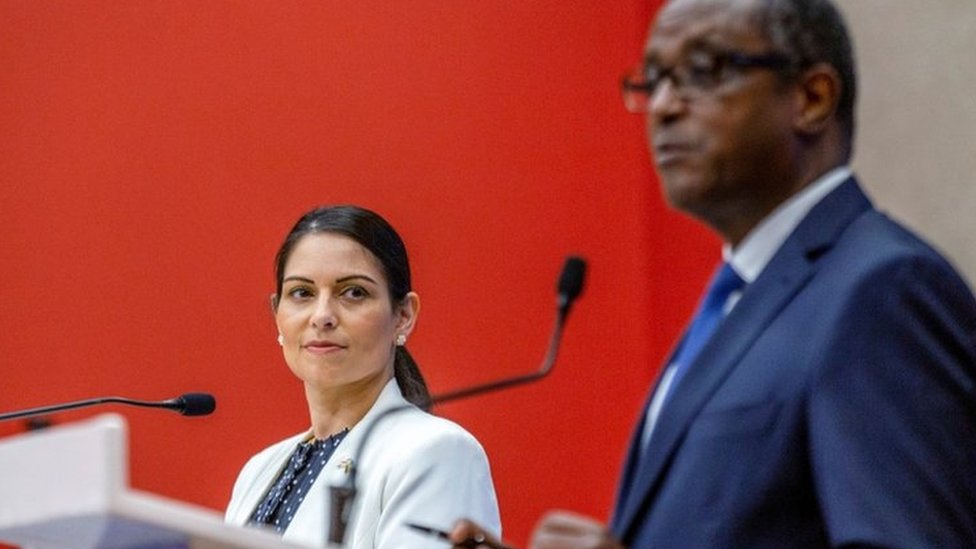 Priti Patel looks on as Foreign Minister Vincent Biruta addresses a news conference