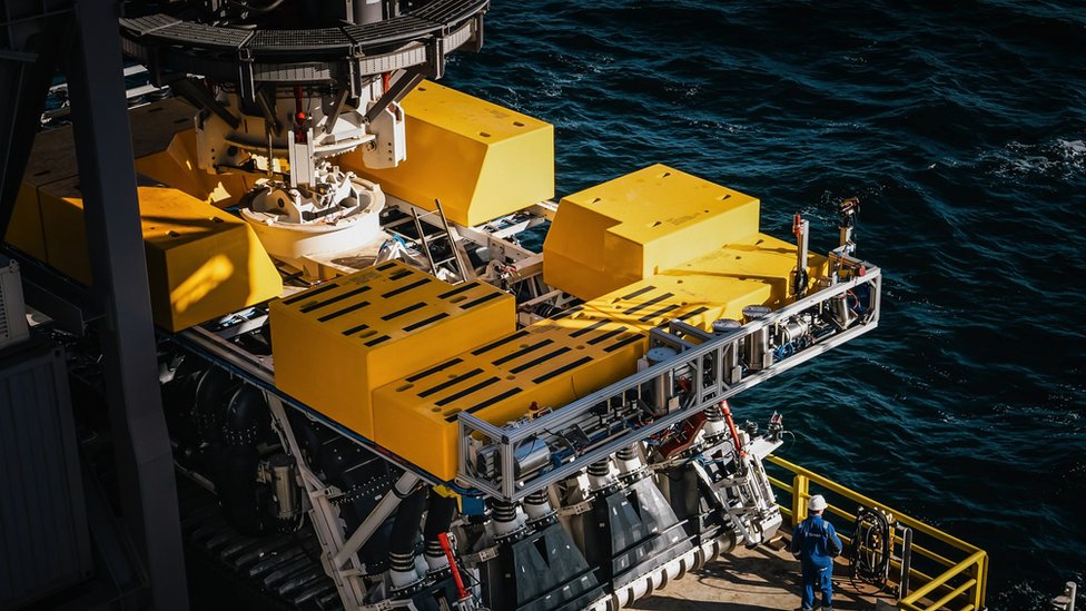 A mineral collecting equipment on the surface of the ocean